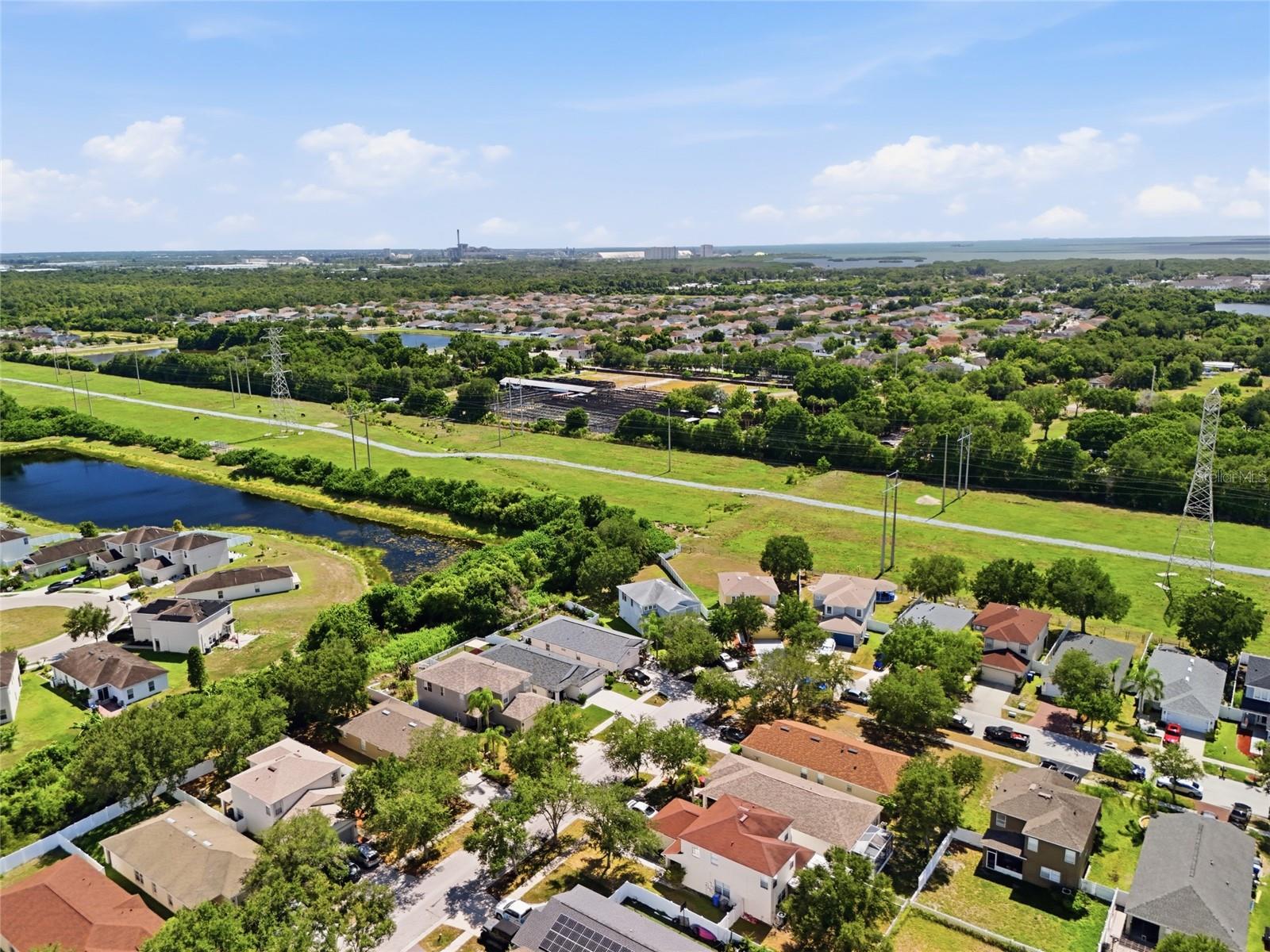 Aerial view of waterway community with conservation views and no rear neighbors