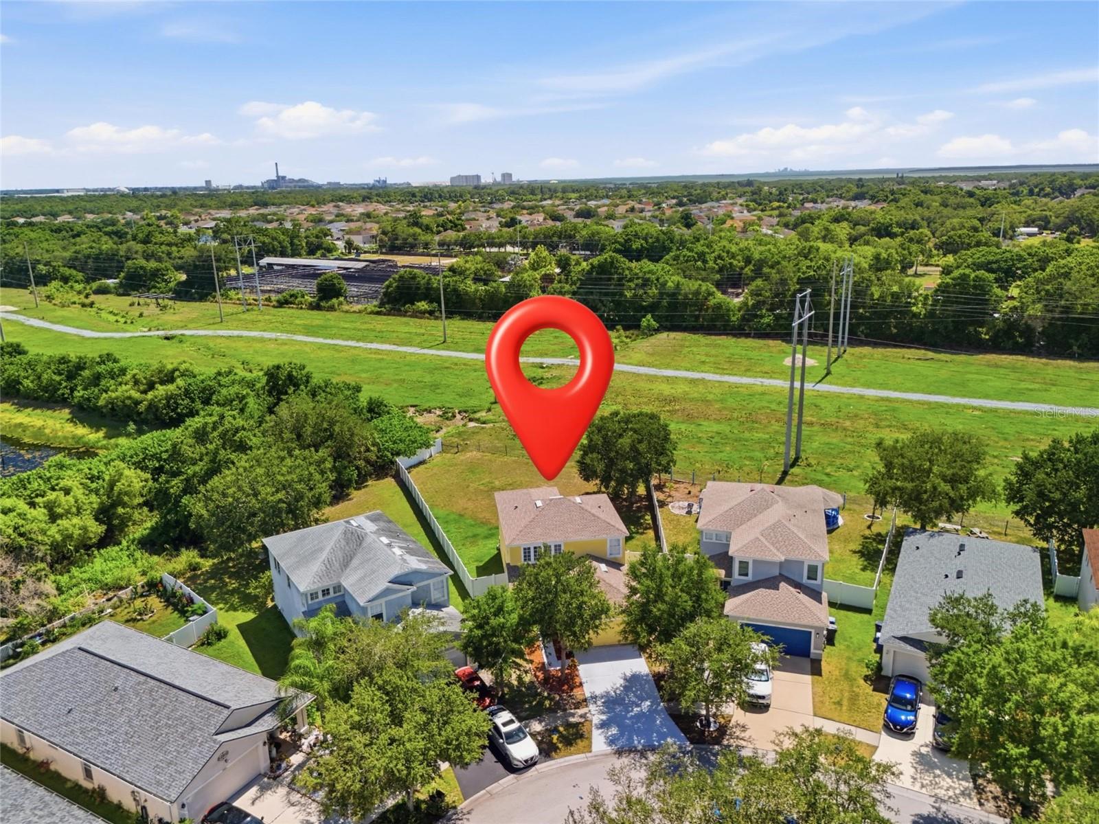 Aerial view of waterway community with conservation views and no rear neighbors