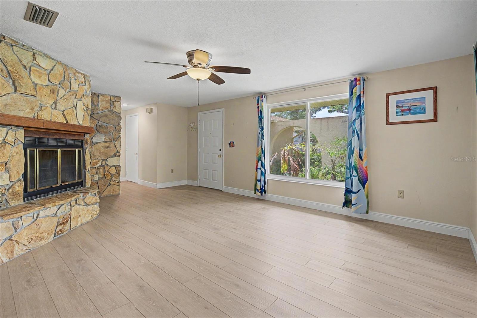 BIG PICTURE WINDOW & WOOD BURNING FIREPLACE