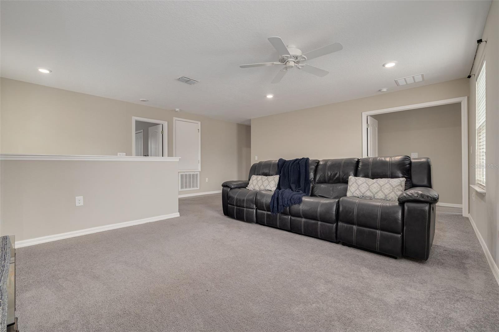 expansive loft perfect for a media room, game room, or additional living space - Upstairs