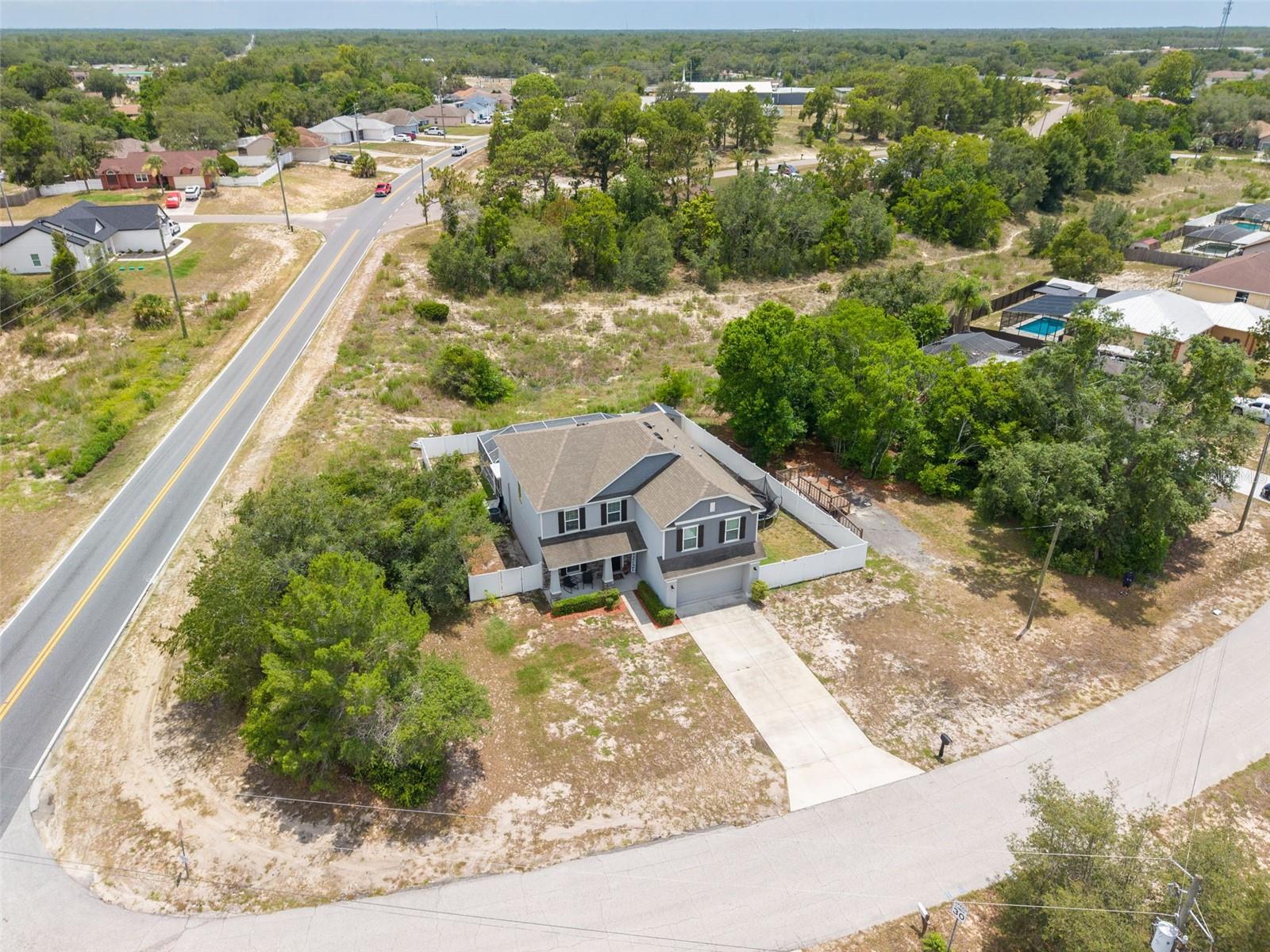 Situated on a desirable corner lot just under one-half acre