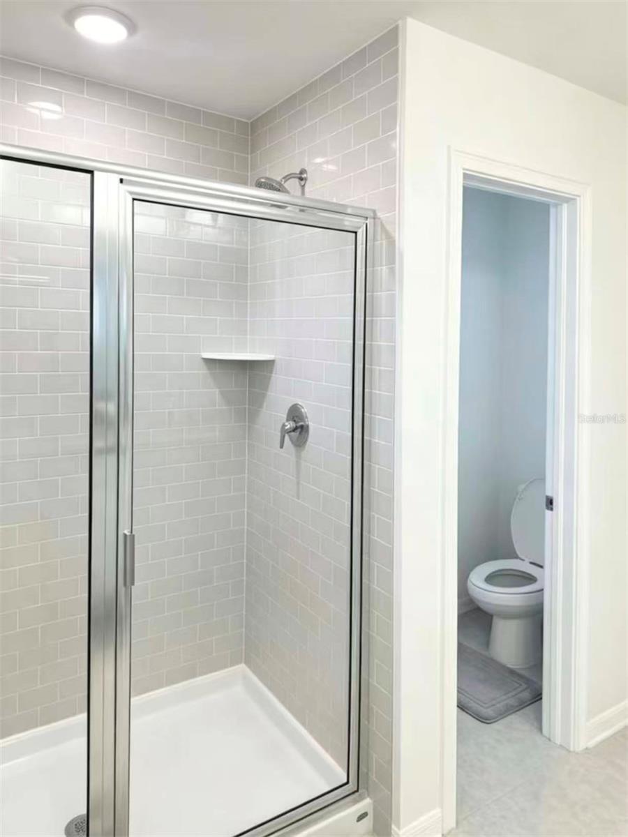 Primary Bathroom with shower and water room