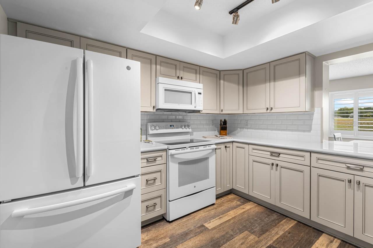 Kitchen opening overlooks dining room