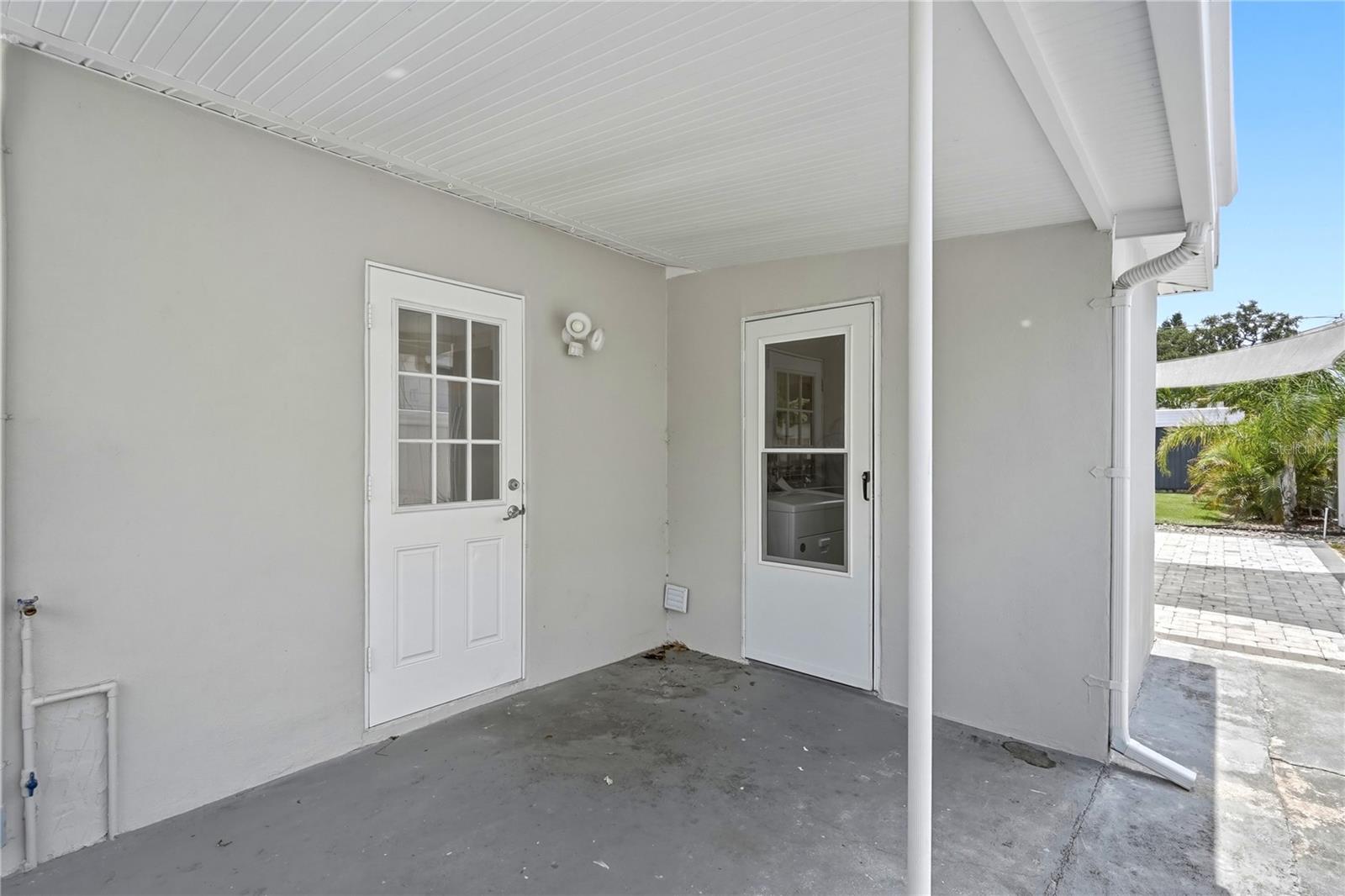side door to kitchen and door to laundry room