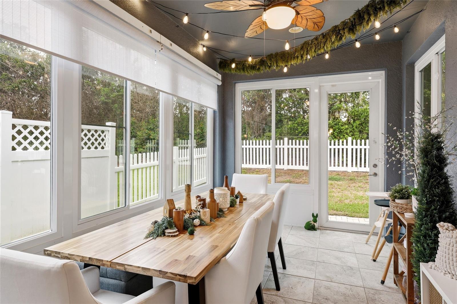 Sunroom with Door Leading to backyard