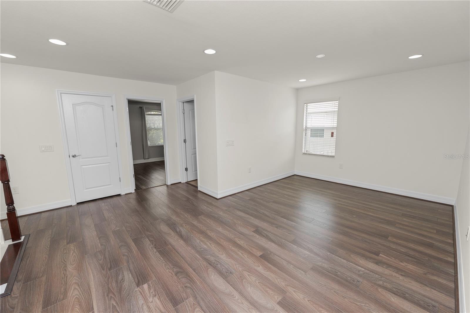 Loft with Laminate Flooring and Entry to Bedroom 2 with Lamenate Flooring