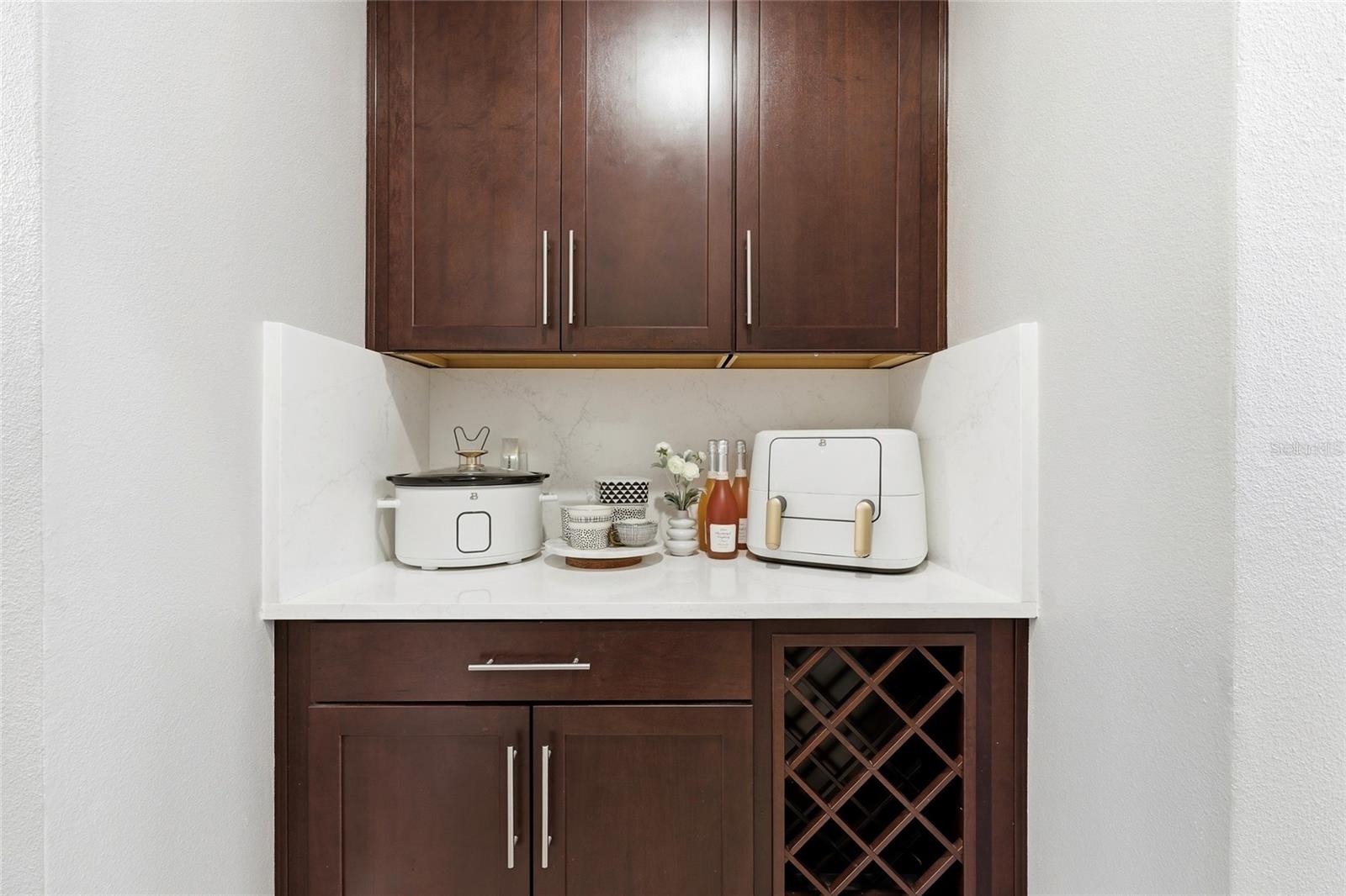 Butlers Pantry with Wine Rack Leading into the Kitchen