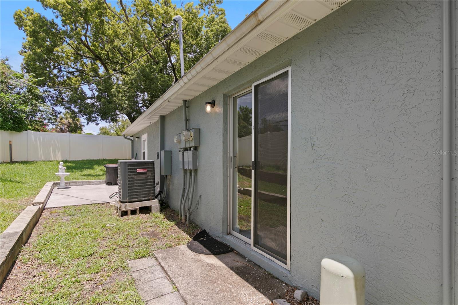 6225 Elmhurst Dr. Rear Elevation with Sliding Glass Doors and Patio