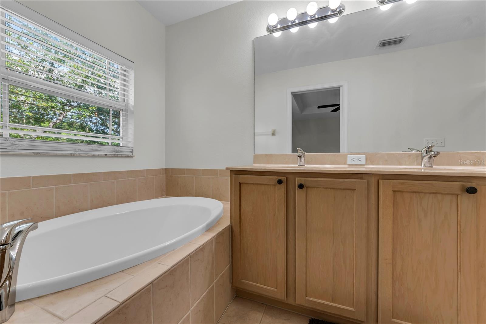 HIS AND HERS SINKS AND GARDEN TUB