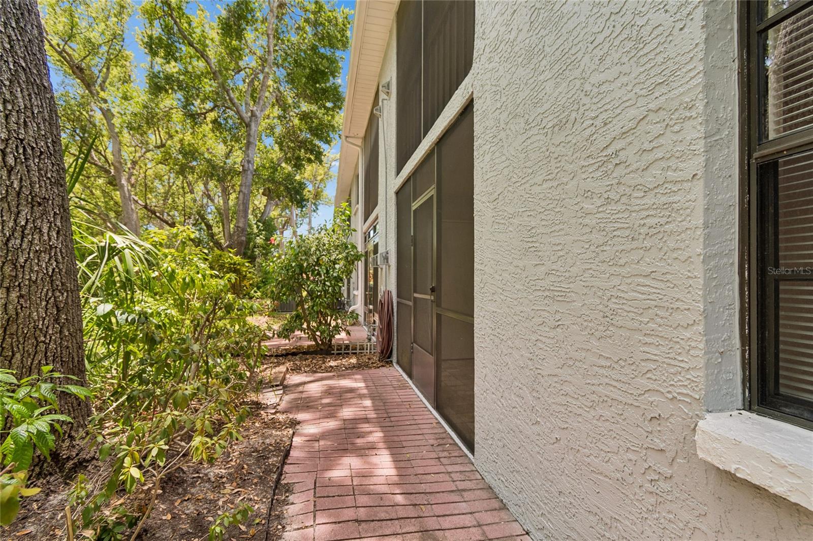 Walkway next to Screened Patio
