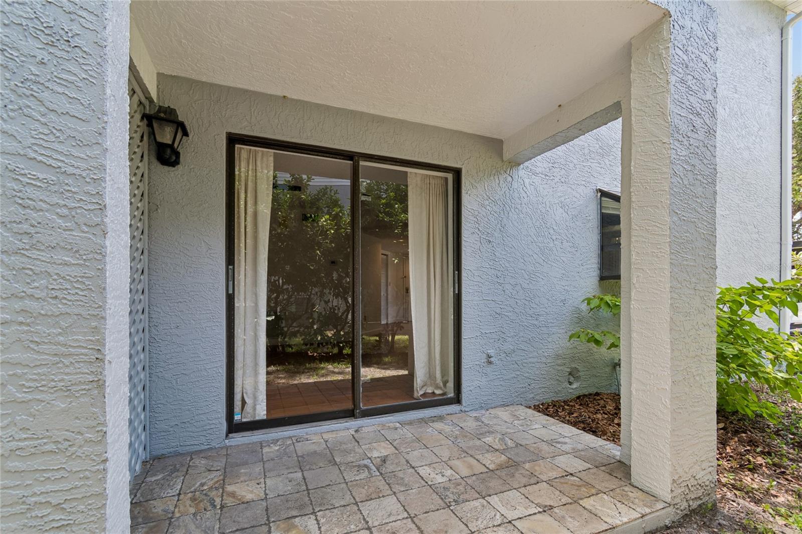 Covered Patio with Entrance to Living RM