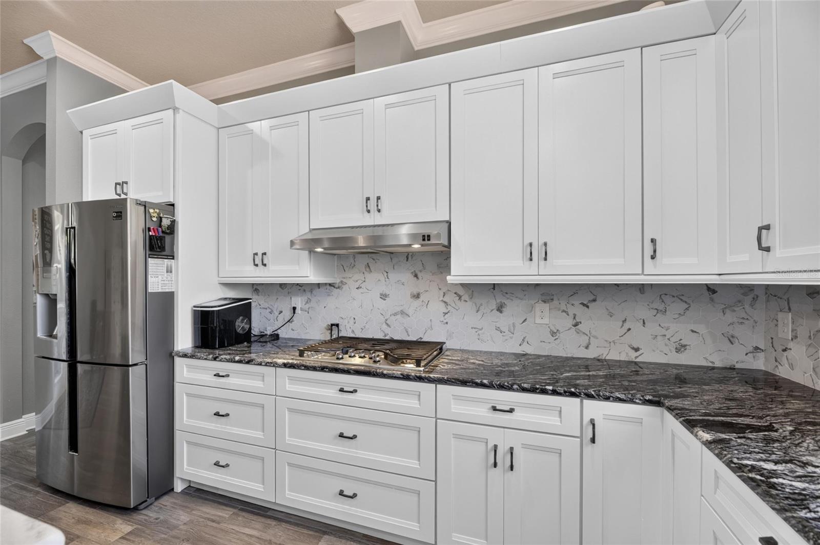 ...wood cabinets and tile backsplashes...