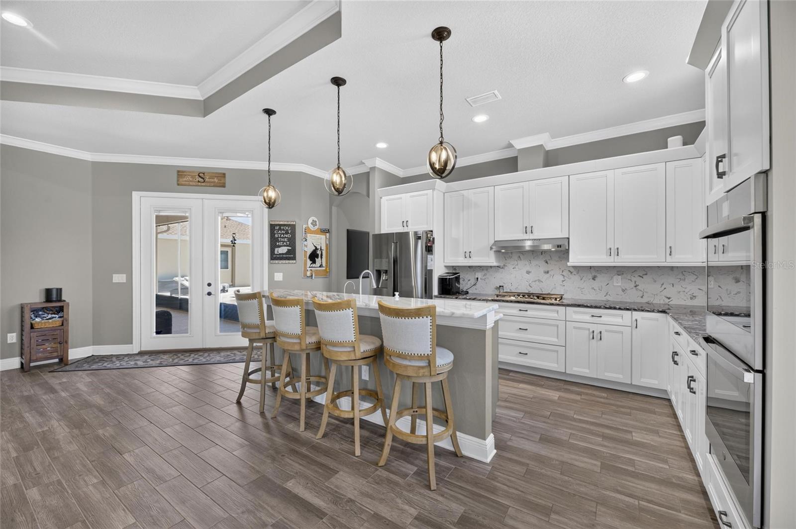 Double wall ovens and a gas range are included.