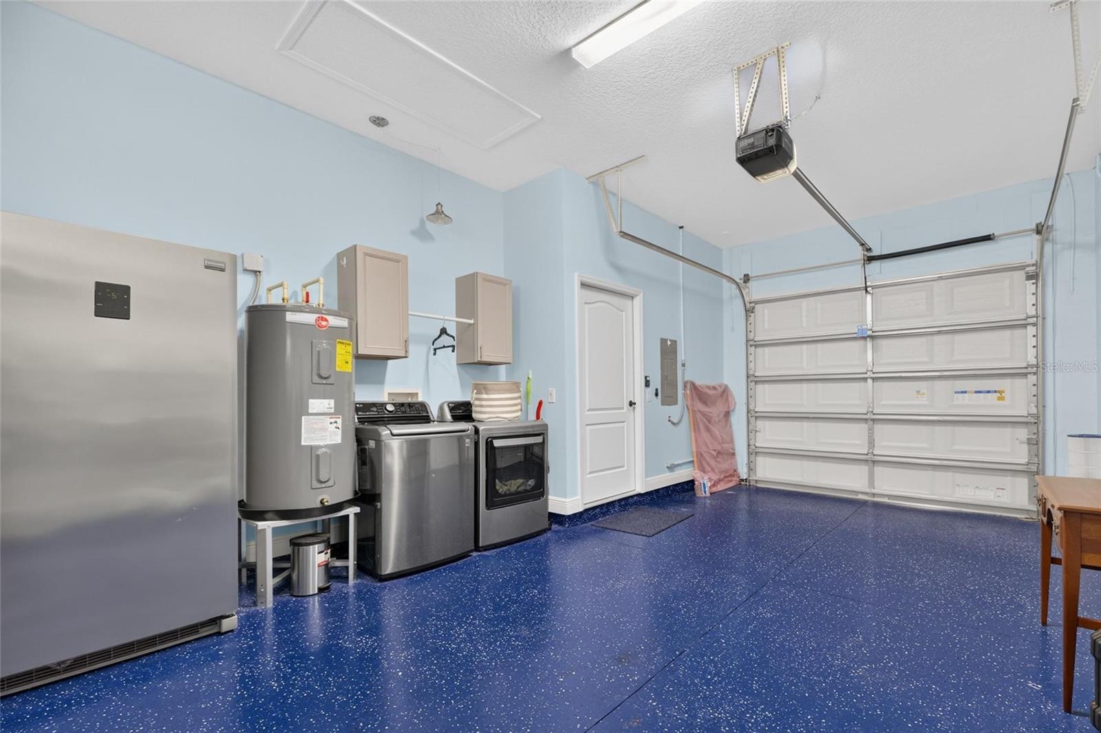 The garage provides a separate water heater and washer/dryer connections for the studio.