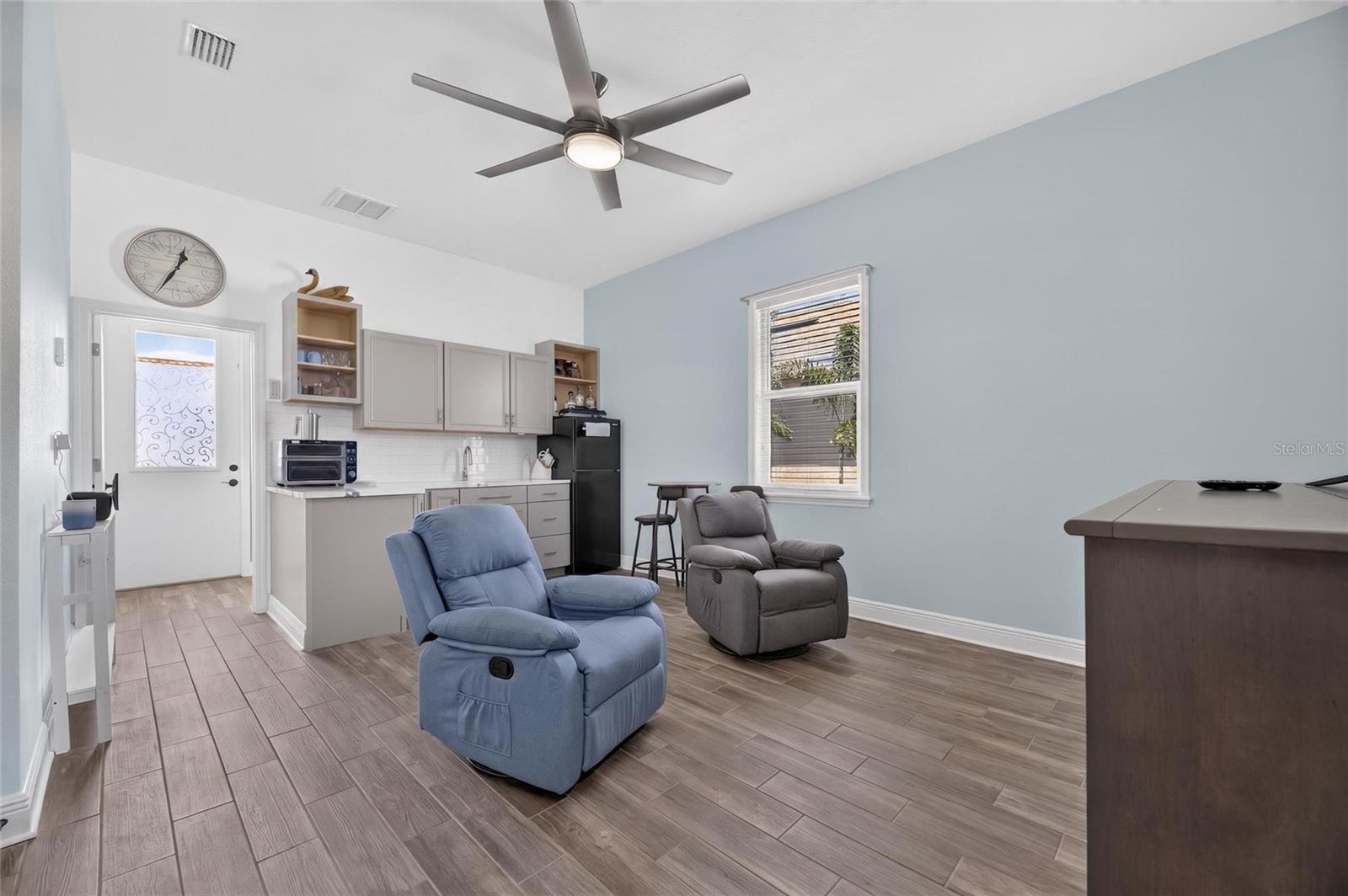 This space is ideal for extended family, guests, a caregiver, or could be set up as a home business office.