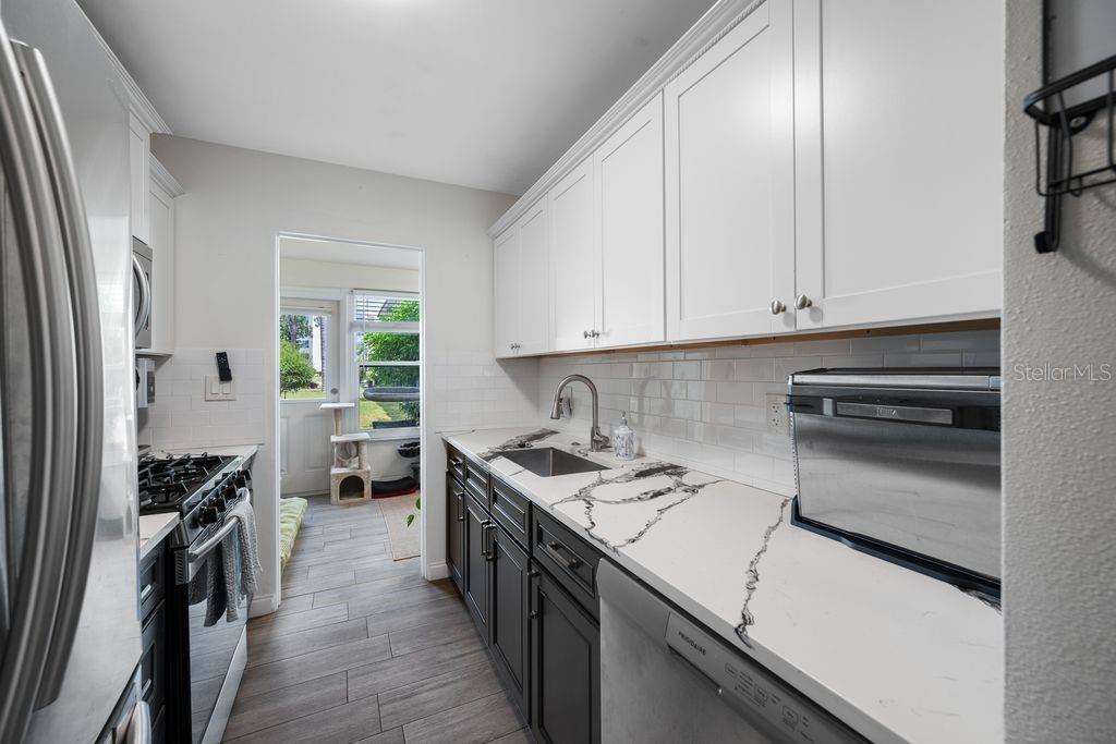 Updated and Modern Galley Kitchen - View into Florida Room