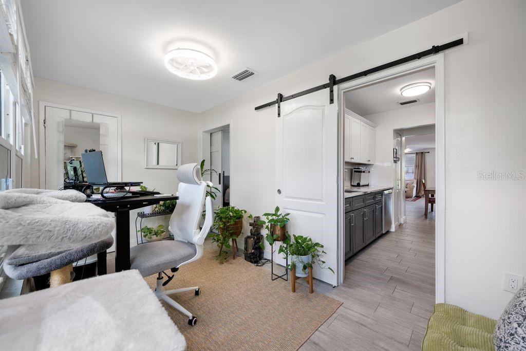 Florida Room with View into Kitchen (Right) and Bedroom (Left) - New Barn Doors offer Privacy