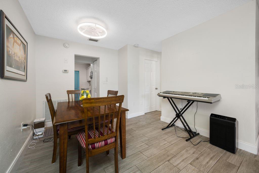 Dining Room - Entrance to Kitchen on Left - Hallway and Bedroom to the Right