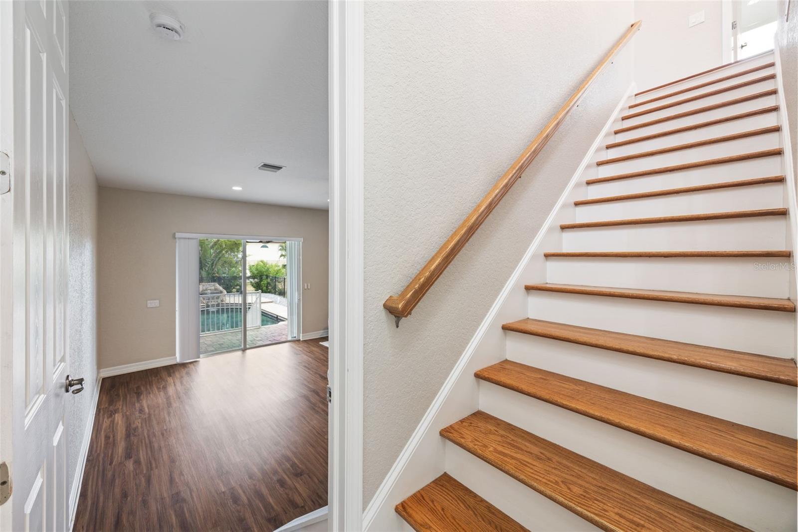 Foyer to bedroom or stairs to additional living areas.