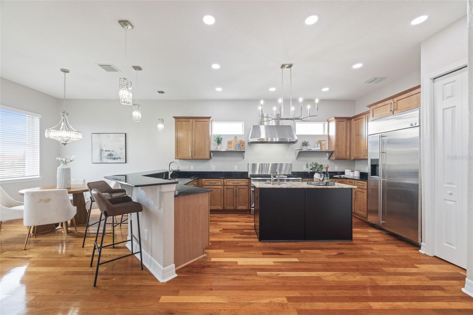 Open floor plan with shared living, kitchen & dining.
