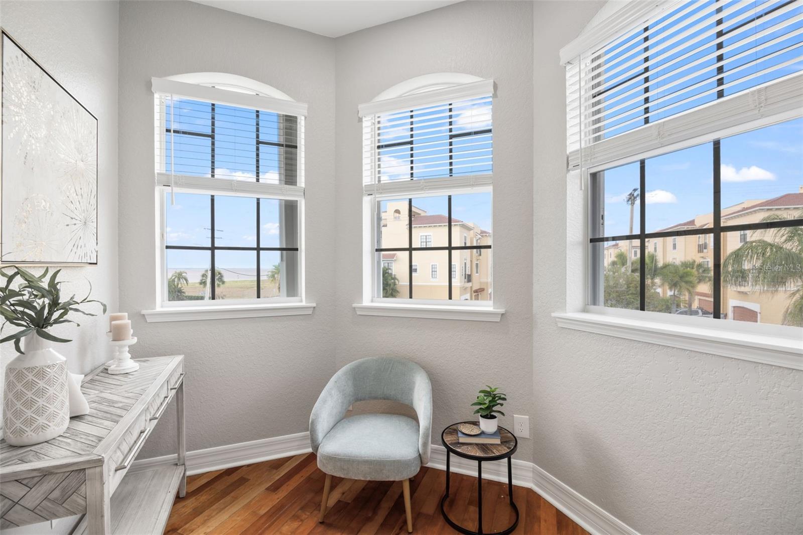 Seating area within the bedroom that has views of the bay.