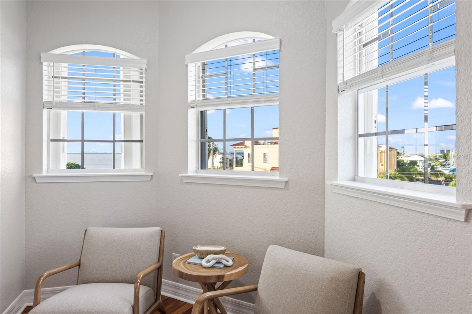 Sitting area in the master bedroom overlooking a gorgeous view of the bay you can see from laying in the bed.
