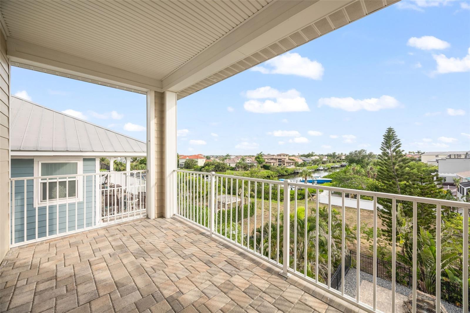 3rd floor balcony overlooking the canal with gorgeous sunset views of the bay.