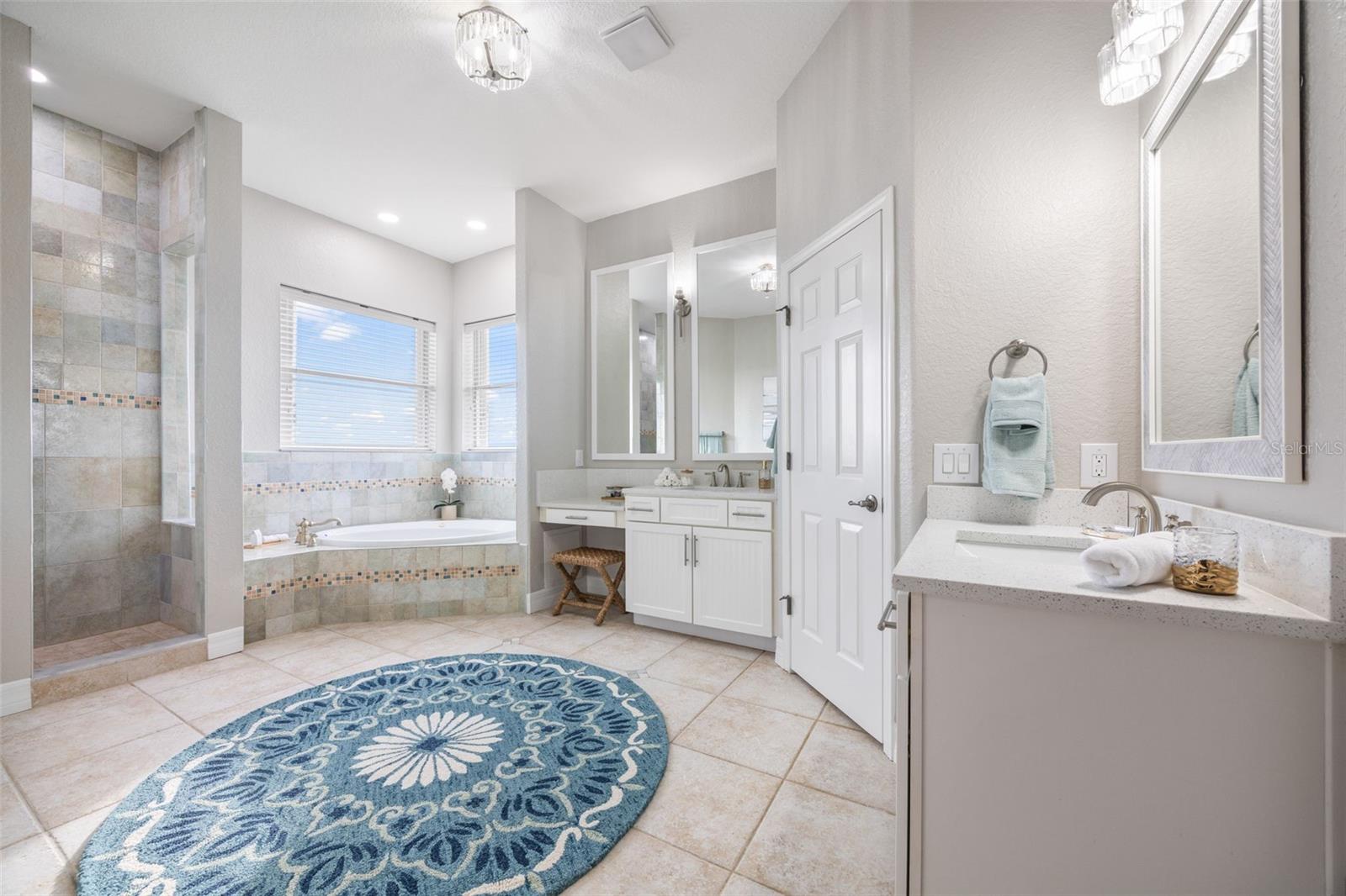 Spacious master bathroom with ample space.