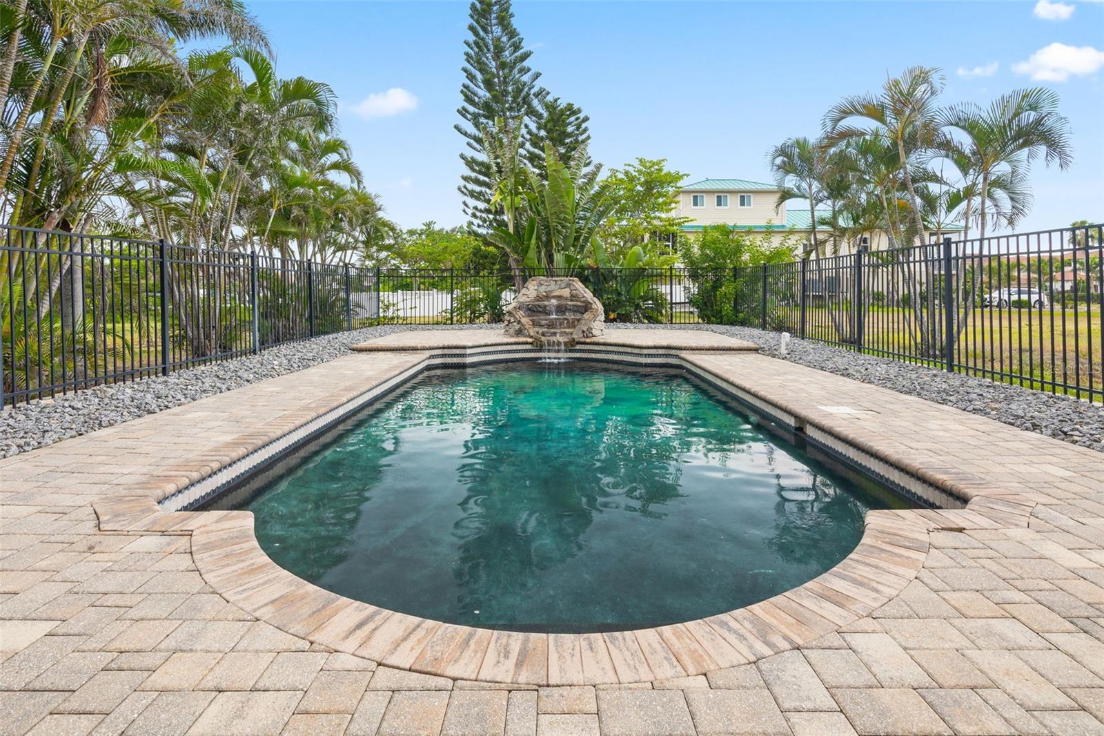 Gorgeous pool in the back with a beautiful waterfall.
