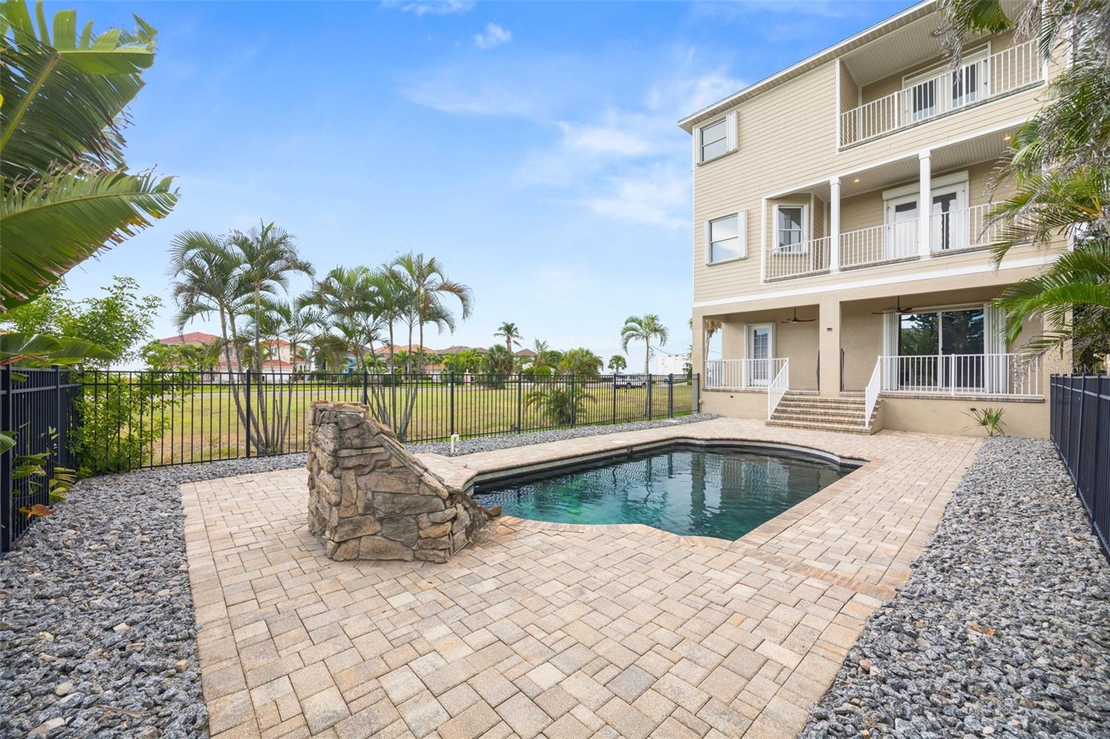 Back pool area. Spacious for lounge chairs.