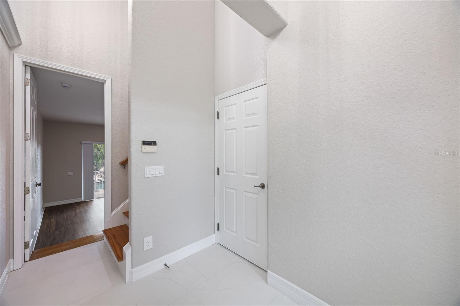 Foyer to garage or 1st floor bedroom.