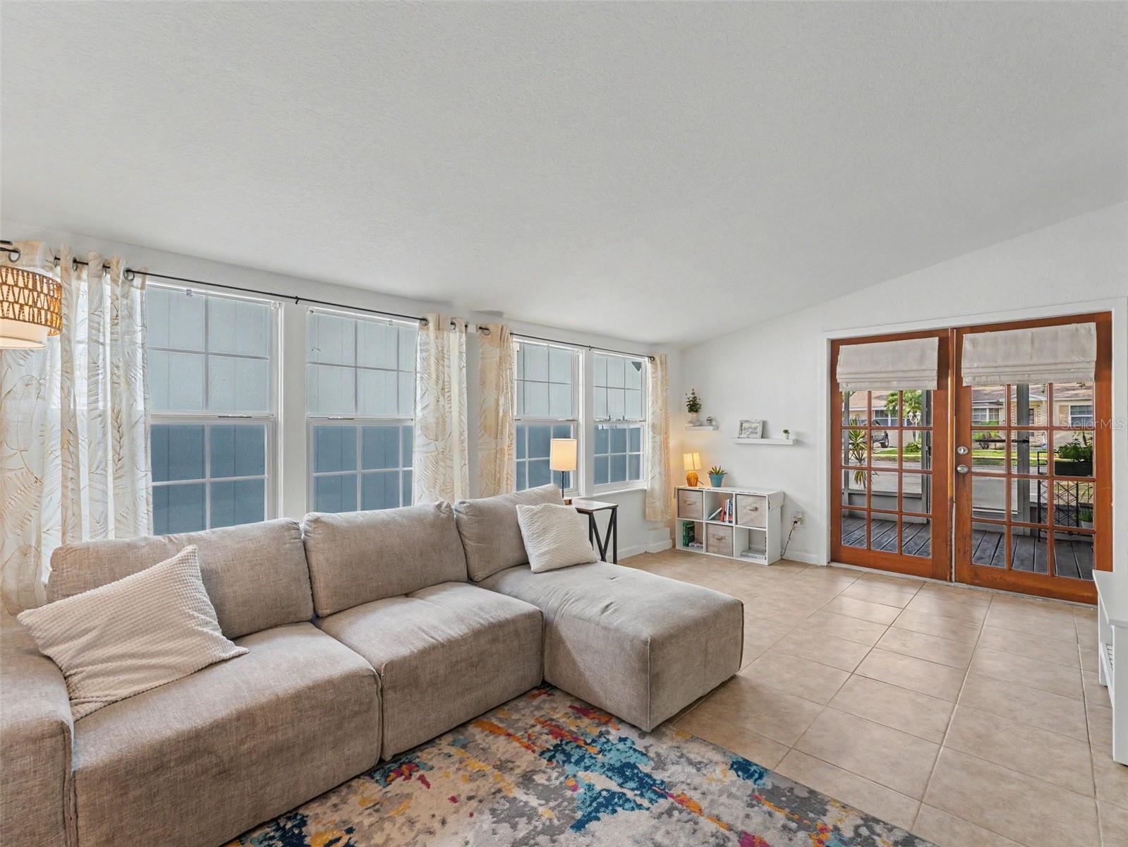 family facing screened side porch