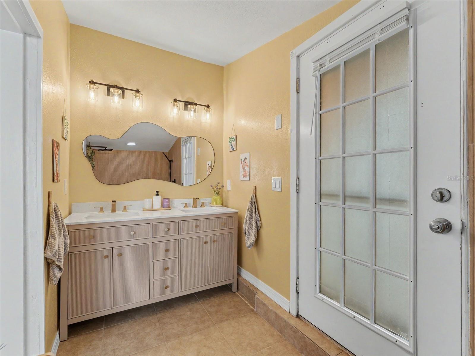dual vanity to outdoor laundry