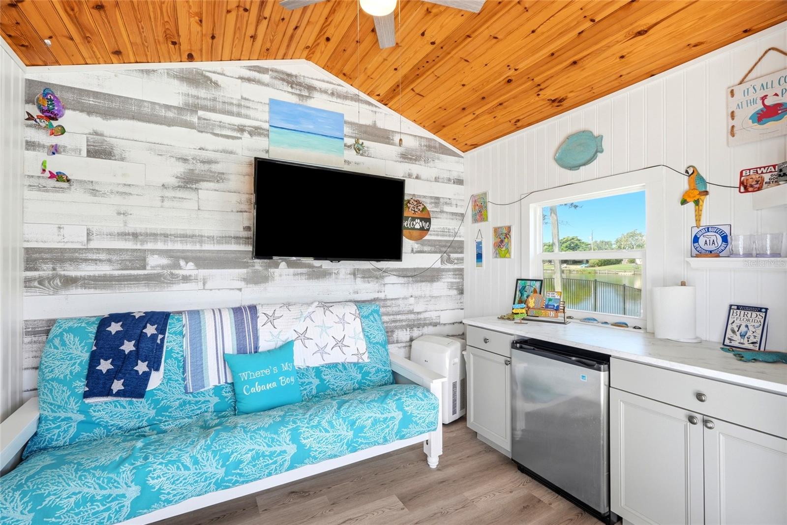 Cabana has kitchen, TV, and a futon