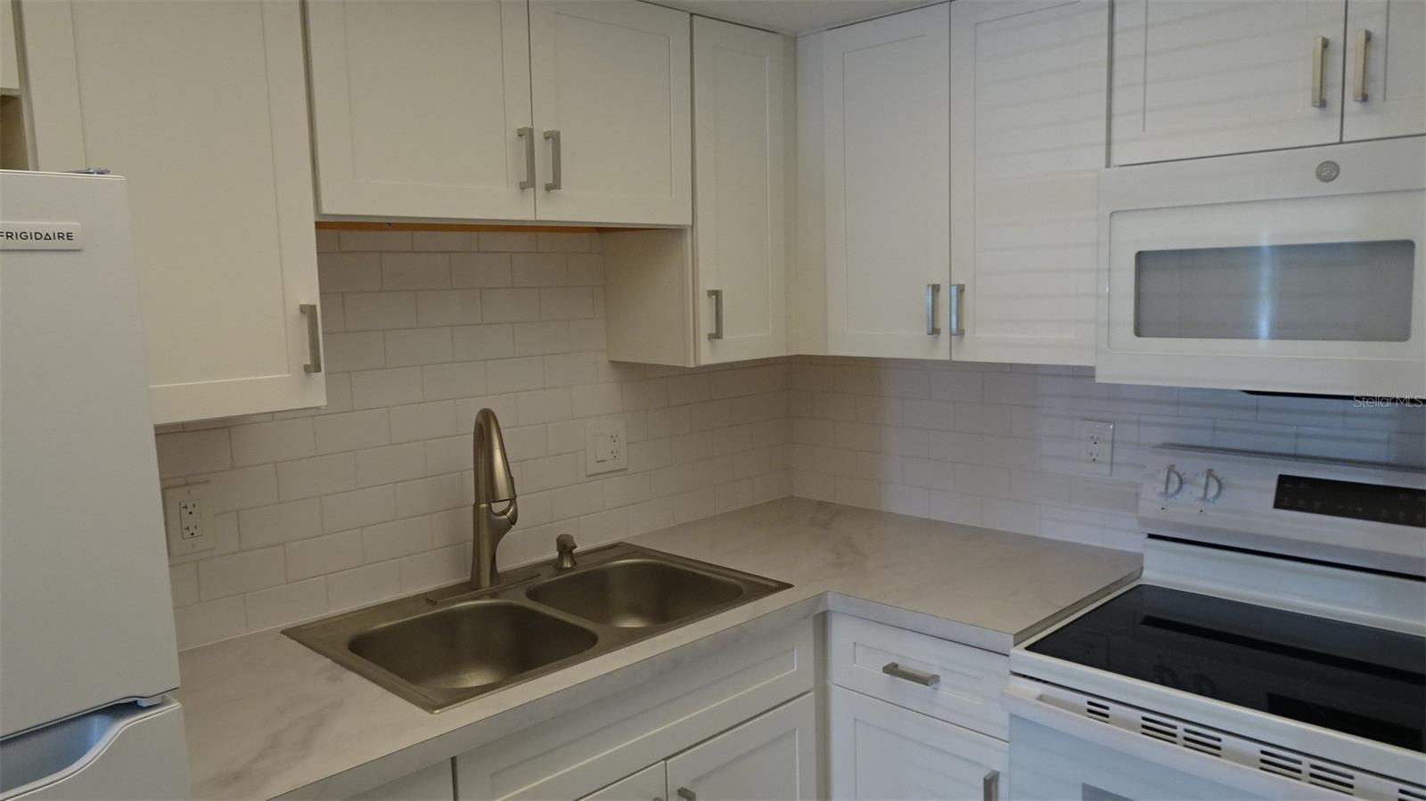 Tile backsplash, double sink
