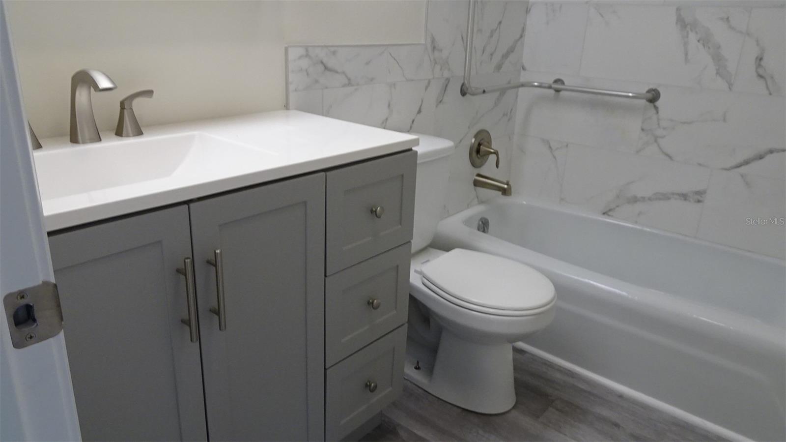 Master ensuite bathroom with tub.