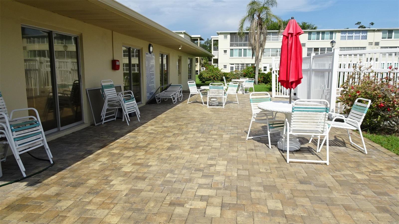 Nice patio between clubhouse and pool.