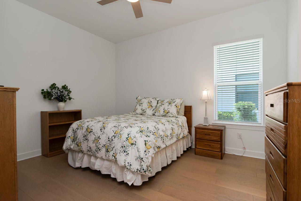 Bedroom #2 - Upgraded Ceiling Fan - Engineered Hardwood Floors - Adjoining Bathroom with separate vanity