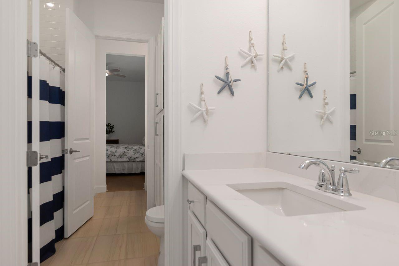 Adjoining Bathroom between Bedrooms #2 and #3 - Separate Vanities for each Bedroom - Quartz Countertops - Shower/Tub Combo