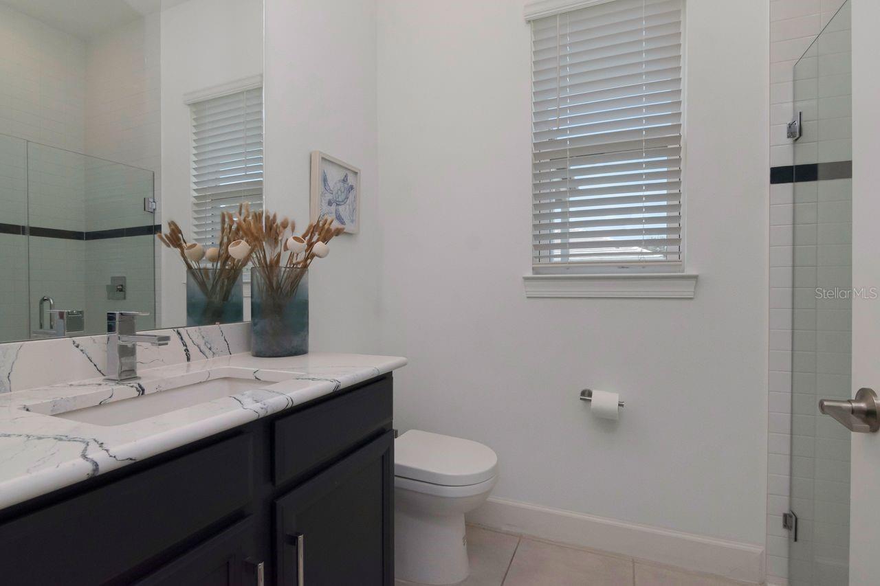 Full Bathroom - Quartz Countertops - Vanity - Access to Door In Bathroom - Access to Lanai