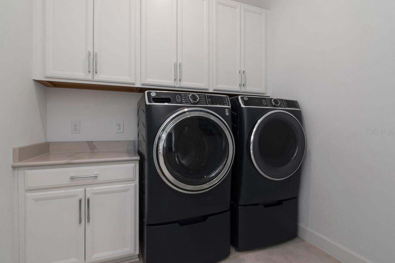 Inside Laundry Room with Ample Cabinet Storage