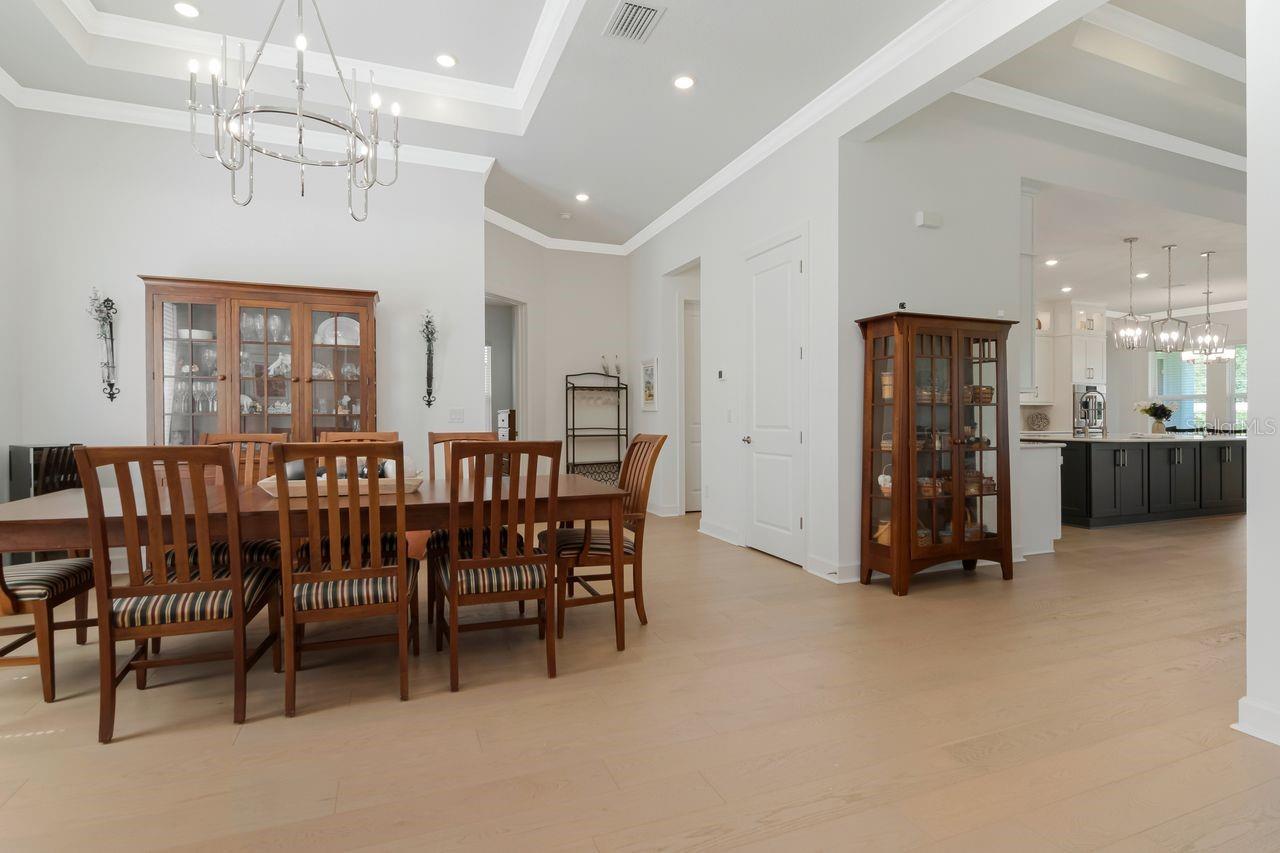 Formal Dining Room, Tray Ceilings with Crown Molding - Chandelier - Engineered Hardwood Floor