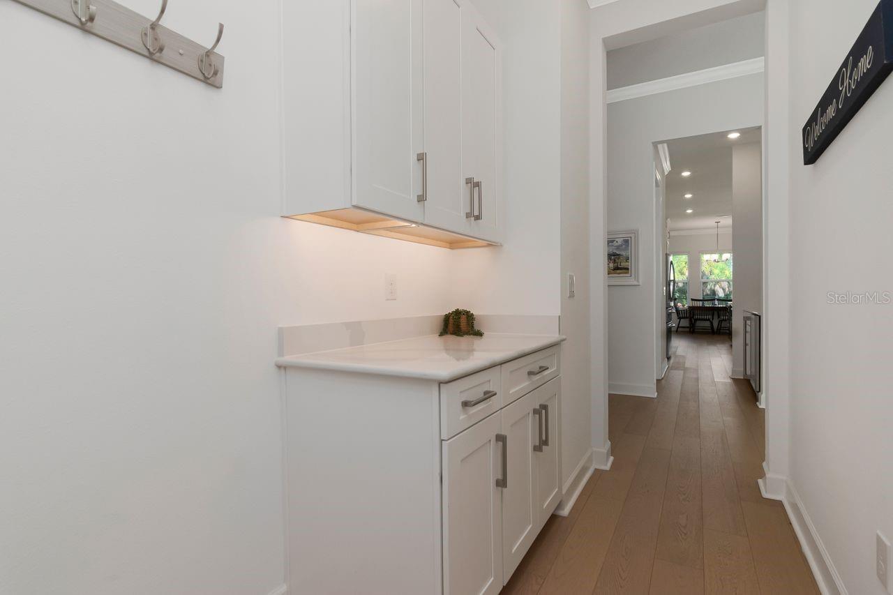 Mud Room Area - Off of 2-Car Garage - Ample Cabinet Storage - Under Cabinet Lighting - Quarts Countertops - Entry and Pass through Butler's Pantry to Kitchen