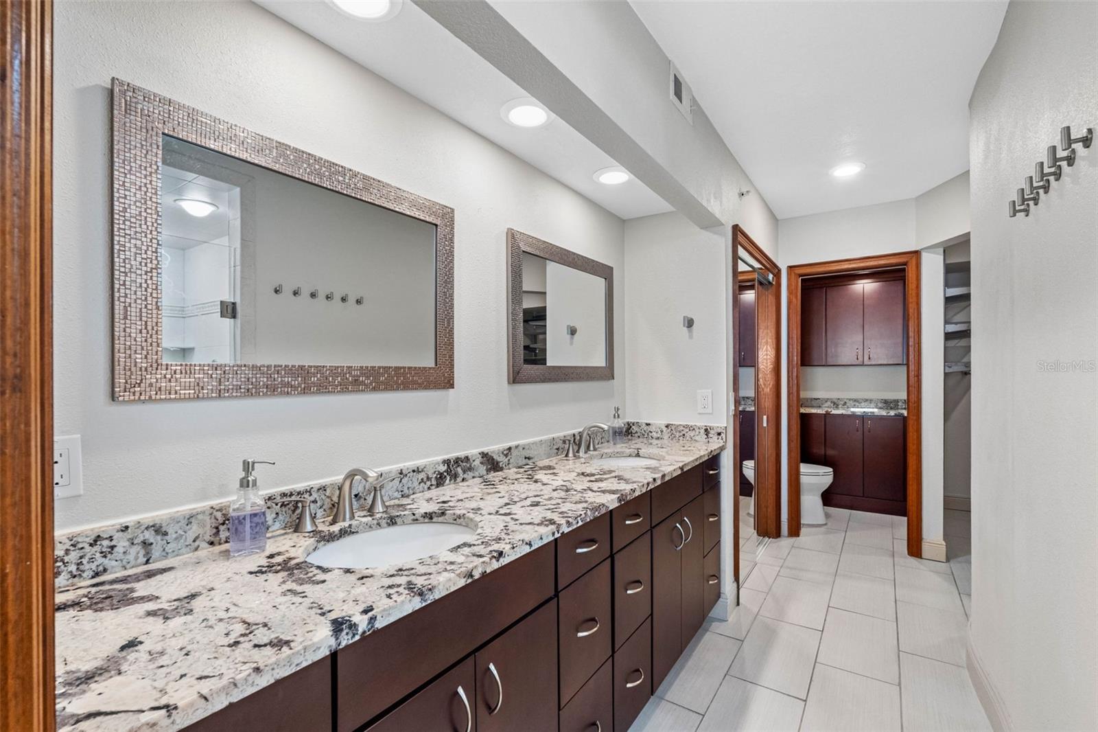... Master Bathroom - Completely Remodeled - Double Vanity - Plenty of Drawers & Closet Space. Closets are Either Side of Privacy Room. There Are Two Closets - One on Either Side of The Privacy Room .