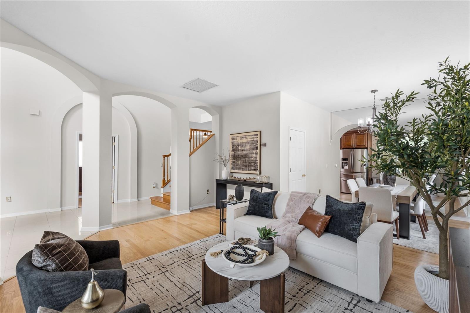 Formal living room with abundant natural light, and spacious layout perfect for hosting guests.