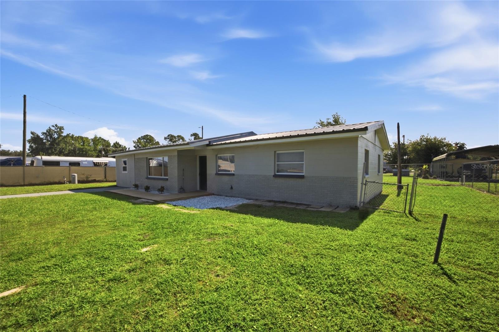 Block home with metal roof. partially fenced.  Wouldn't take much for new homeowner to finish fencing