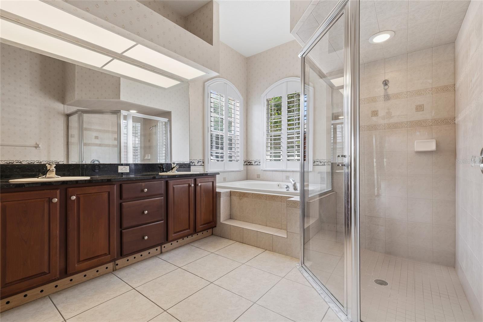 PRIMARY BATHROOM WITH WALK-IN SHOWER AND DOUBLE SINKS