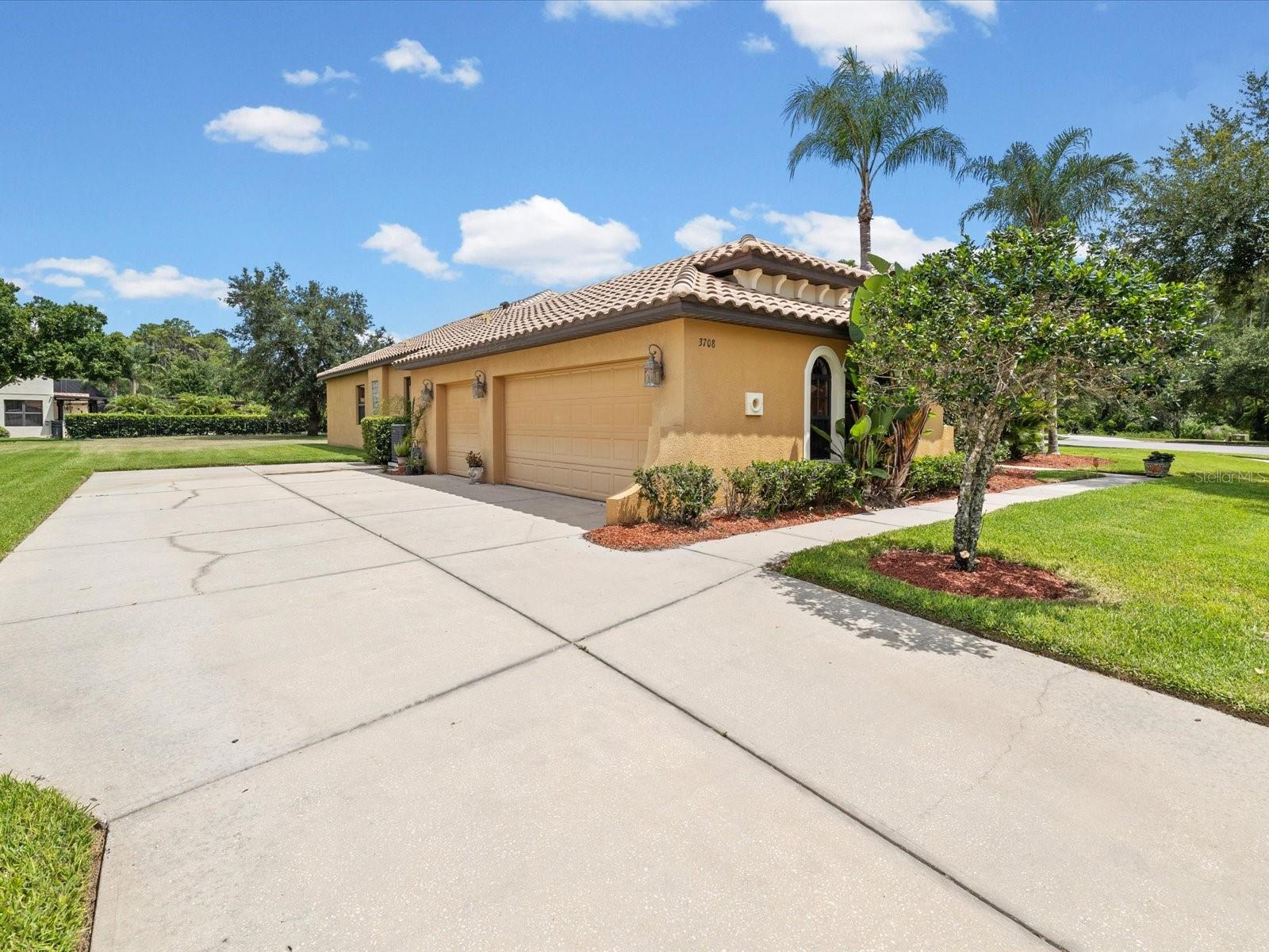 3 car garage, with oversized parking pad