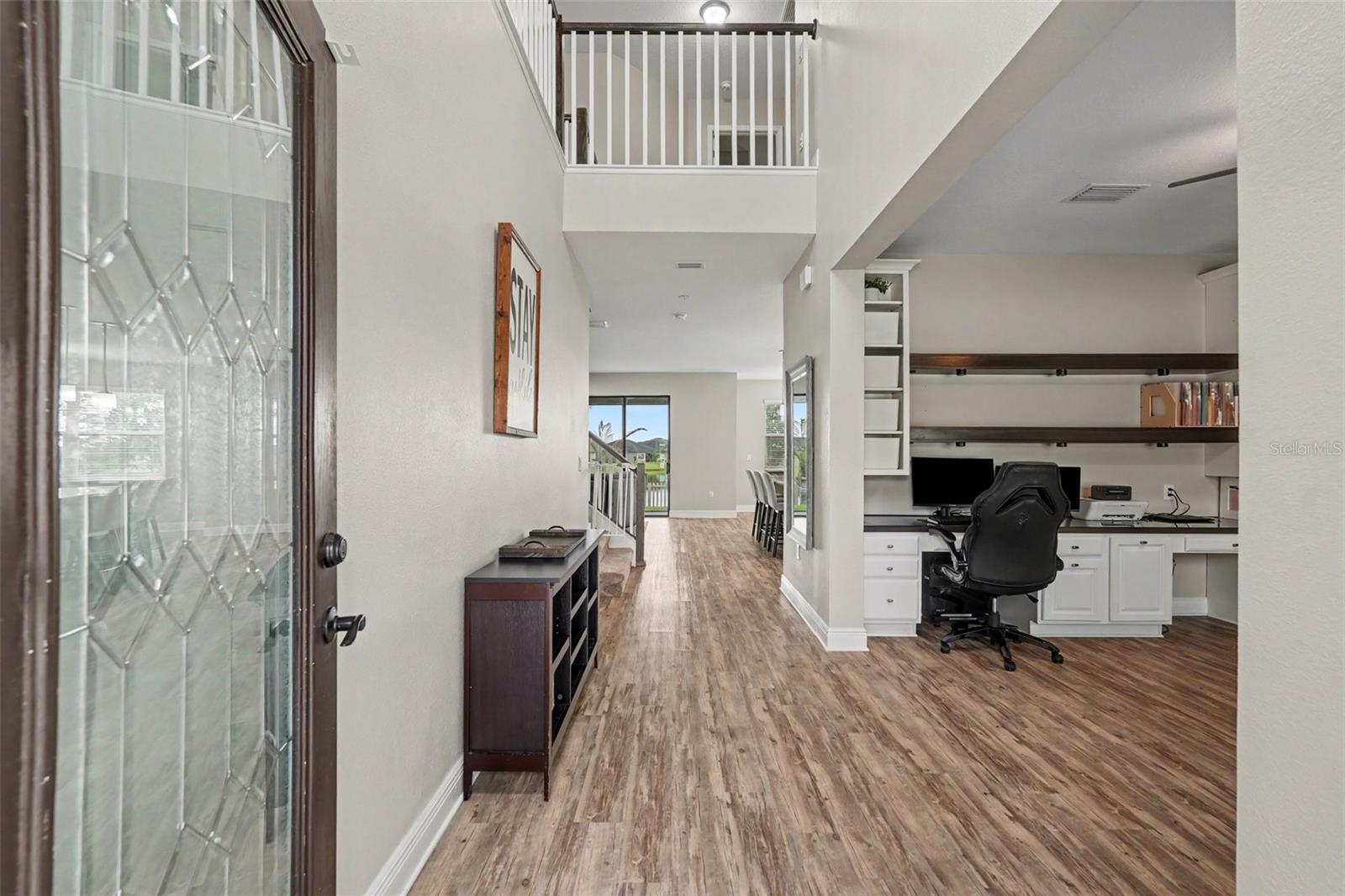 Enter this home through a beautiful glass paned door