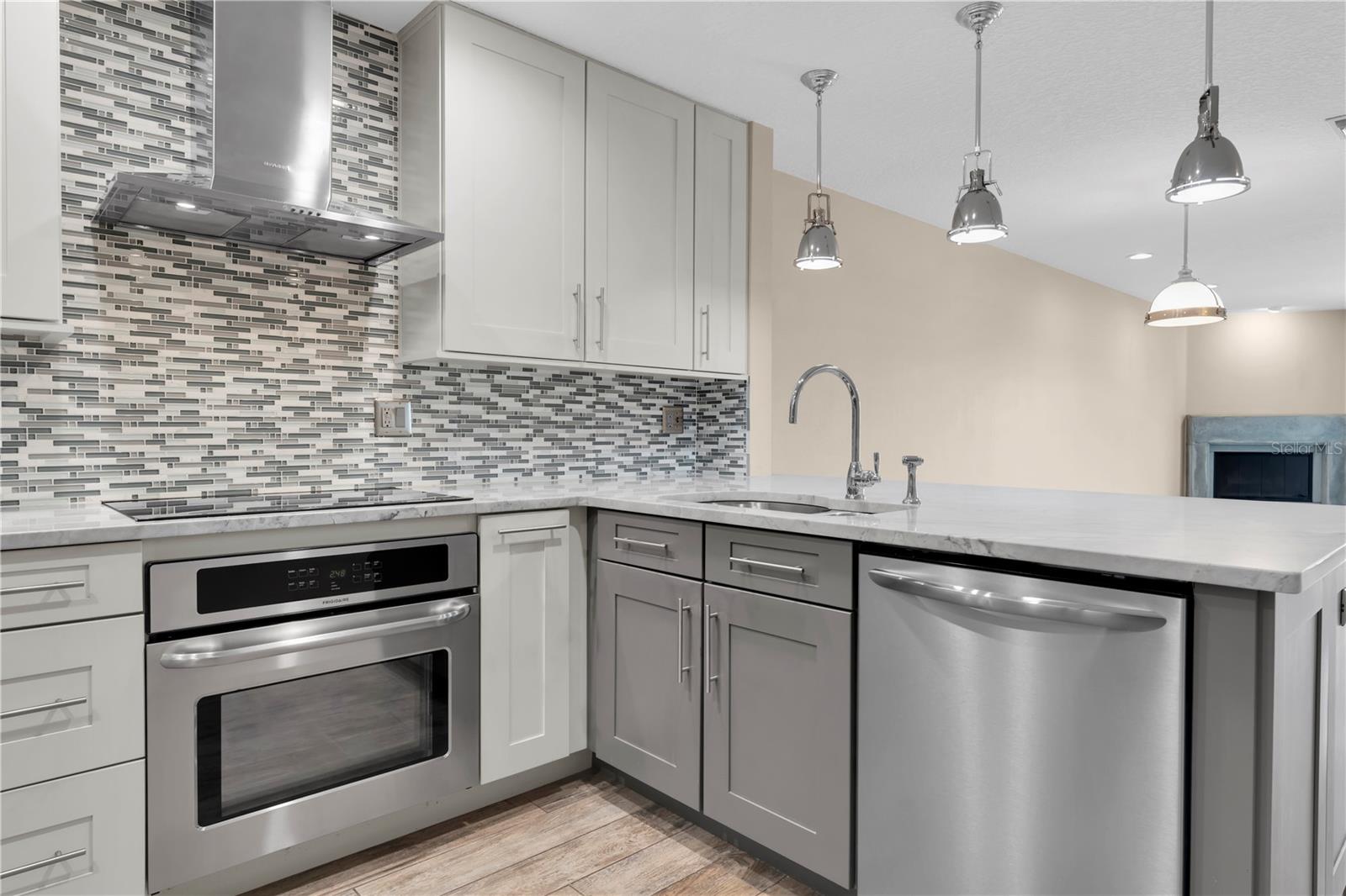 Every detail here was chosen with intention — from the statement hood to the seamless cabinetry — creating a kitchen that feels custom, not cookie-cutter.